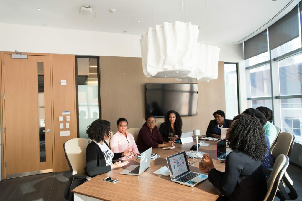 a group of people working together at a table