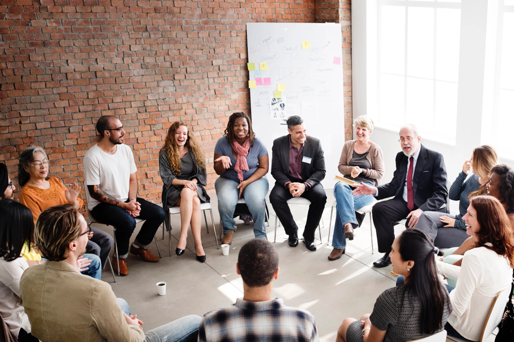 Participants of a leadership training program having a group discussion.