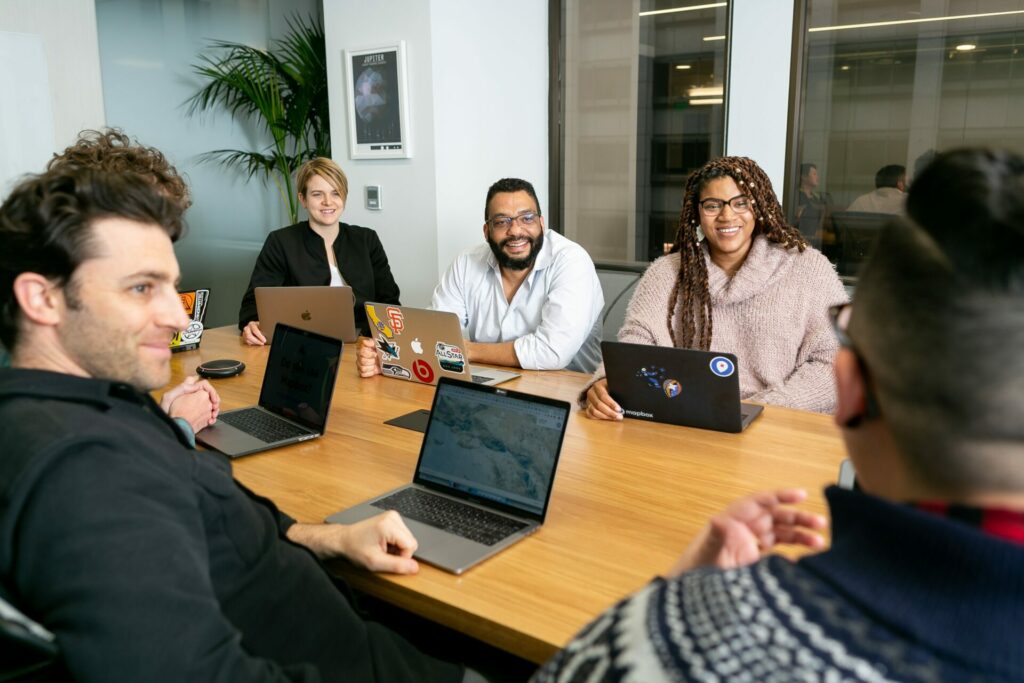 coworkers in the office with laptops