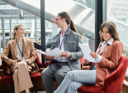 Three women in a corporate team building activity