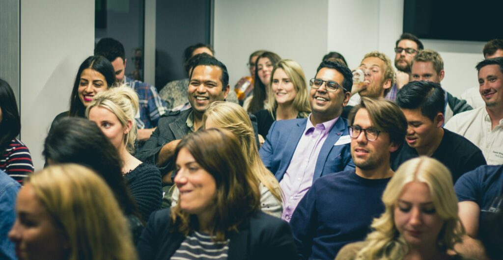 group of people sitting at a professional event