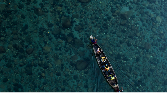 a group of people in a boat